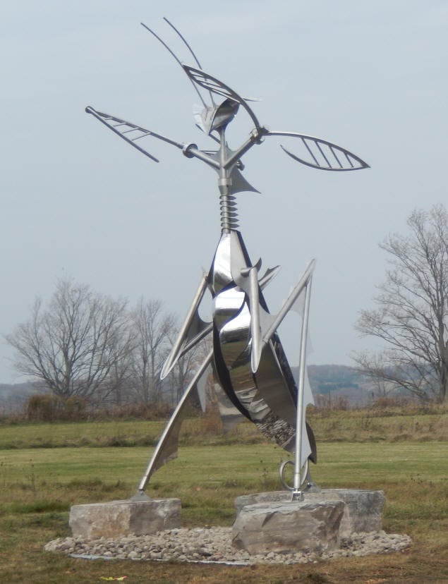The Queen Mantis (above) was built by Stainless Outfitters for Ron Baird. The sculpture is all stainless steel, stands approximately 18' high and the arms and head move gently when there is wind present.
